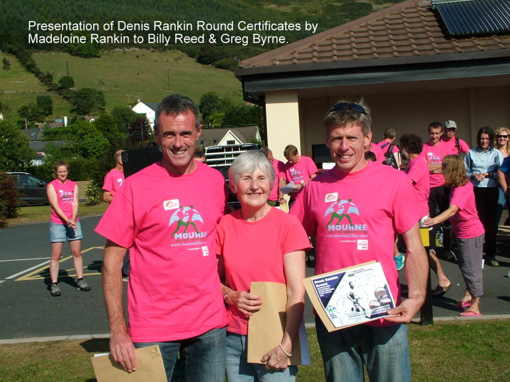 Billy and Greg receive their certificates from Madeline Rankin